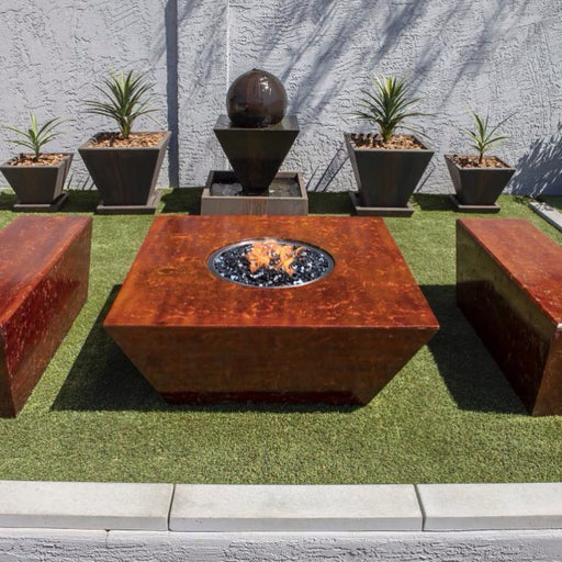 Square fire table with two benches with grass floor